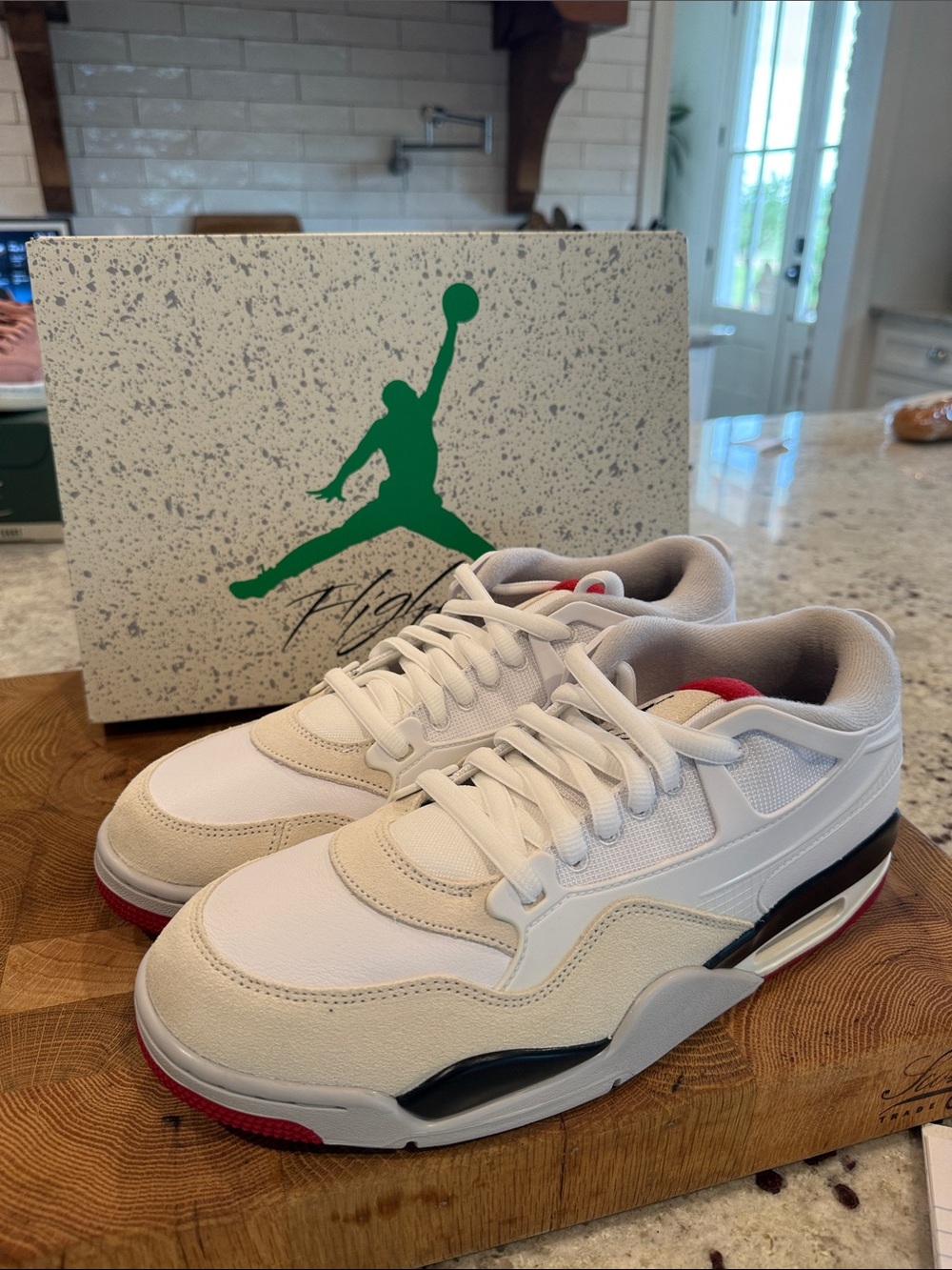 Men's Nike Air Jordan’s White and Black Low-Top Sneakers with Red Accent